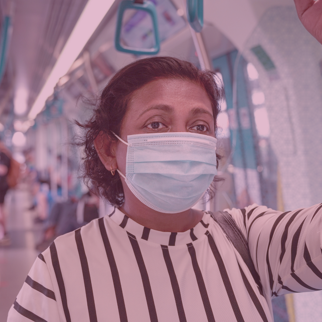 Woman wearing a mask on public transportation