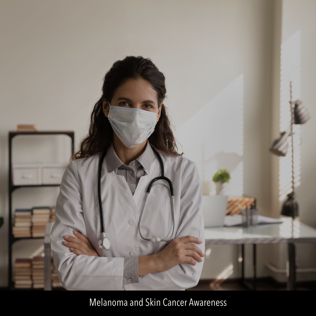 Image of masked female doctor standing in her office